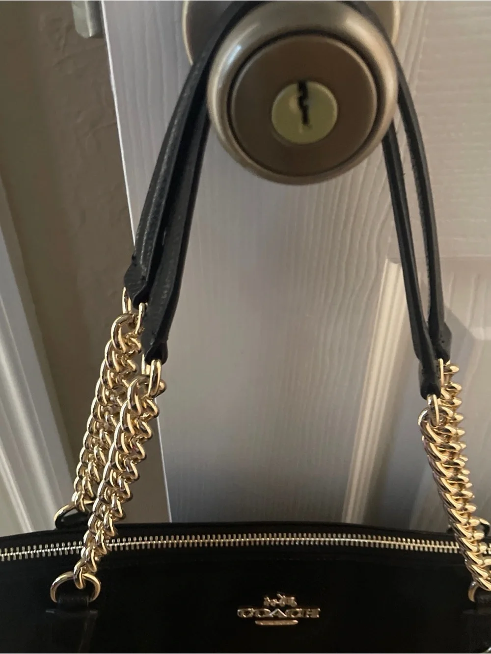 Coach sleek black